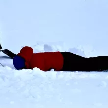 Sarah doing science in snow at Point Barrow